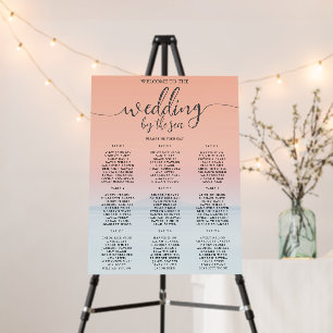 Wedding by the sea under peachy sky sunset foam board