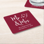 Wedding Favor Mr Mrs Burgundy Square Paper Coaster<br><div class="desc">Decorate your wedding reception tables and give your wedding guests a fun souvenir keepsake of your special day with these custom burgundy red coasters with "Mr & Mrs" written in a large white script and an illustration of two hearts joined together. Add your name and wedding date.</div>