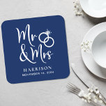 Wedding Favor Mr Mrs Navy Blue Square Paper Coaster<br><div class="desc">Decorate your wedding reception tables and give your wedding guests a fun souvenir keepsake of your special day with these custom dark navy blue coasters with "Mr & Mrs" written in a large white script and an illustration of two wedding rings joined together. Add your name and wedding date.</div>