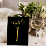 Wedding gold glitter black elegant table number<br><div class="desc">Faux gold foil formal calligraphy script wedding reception table card. The black background color is editable. You can change it after selecting CUSTOMIZE FURTHER button.
You can find the whole range of numbers ( 1 - 50) here: http://bit.ly/2sLMaFh</div>