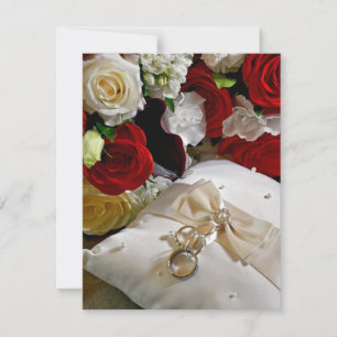 Wedding invitation with roses and rings on front