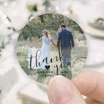 Wedding Photo & Elegant Black Script Thank You Classic Round Sticker<br><div class="desc">Add an elegant personalized touch to wedding thank you cards and reception party favors with these custom photo round stickers / envelope seals. Picture, couple's names, date and heart are all simple to customize. (IMAGE PLACEMENT TIP: An easy way to center a photo exactly how you want is to crop...</div>