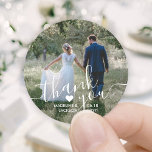 Wedding Photo & Elegant White Script Thank You Classic Round Sticker<br><div class="desc">Add an elegant personalized touch to wedding thank you cards and reception party favors with these custom photo round stickers / envelope seals. Picture, couple's names, date and heart are all simple to customize. (IMAGE PLACEMENT TIP: An easy way to center a photo exactly how you want is to crop...</div>