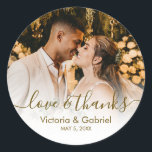 Wedding Photo Gold Script Photo Thank You Classic Round Sticker<br><div class="desc">Modern Pretty Gold Calligraphy Script Thank You | Couple Photo Wedding sticker/label for yor gift favor. Featuring an elegant handwritten style calligraphy overlay with text „Love and Thanks”.</div>