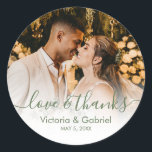 Wedding Photo Green White Script Photo Thank You Classic Round Sticker<br><div class="desc">Modern Pretty Sage Green White Calligraphy Script Thank You | Couple Photo Wedding sticker/label for yor gift favor. Featuring an elegant handwritten style calligraphy overlay with text „Love and Thanks”.</div>