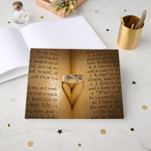 Wedding Ring Heart Shadow On Bible Guest Book