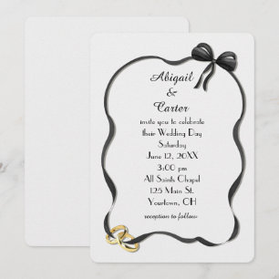 Wedding Rings and Bow Frame On White Invitation