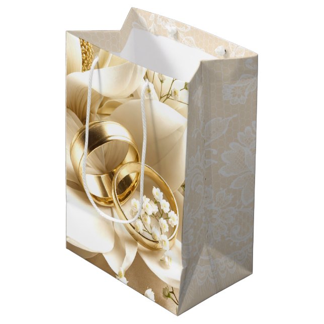 Wedding Rings On Magnolia Flower Medium Gift Bag (Front Angled)