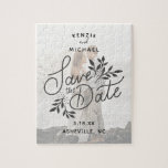 Wedding Save the Date Pretty Calligraphy Botanical Jigsaw Puzzle<br><div class="desc">Fun save the date puzzle featuring a beautiful hand drawn save the date botanical graphic overlayed on your "muted" photo. Add your names, date and wedding location too customize. Send out to your special guests or use as a favor for an engagement party, bridal shower or bachelorette party. Simple yet...</div>