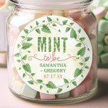 Wedding Shower Mint to Be Watercolor Leaf Wreath Classic Round Sticker<br><div class="desc">These beautiful stickers are perfect for your wedding or bridal shower mint favors. They include hand-drawn mint leaves and vines in a garland with a watercolor look, in shades of green and brown. The background has a light watercolor effect, made in golden yellow and white. The text says, "Mint to...</div>