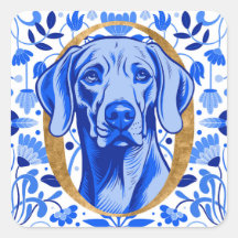 Weimaraner peering thru the letter "O" in Gold