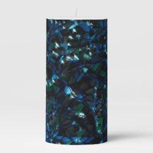 Weird mosaic over dark background and hazy sparkle pillar candle