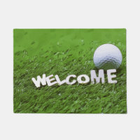 Welcome golfer with golf ball on green grass doormat