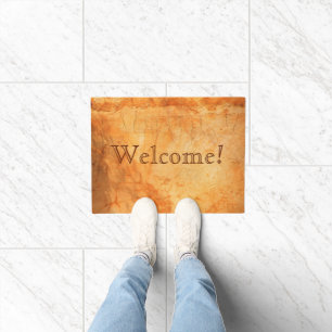 Welcome terracotta colored brick wall doormat