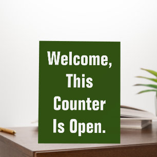 Welcome This Counter Is Open Green and White Text Foam Board