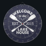 Welcome to the Lake House | Rustic Canoe Paddles Dartboard With Darts<br><div class="desc">Spend your leisurely lakeside hours playing darts with this fun,  unique dartboard. Design features a midnight blue background with "Welcome to the Lake House" in rustic block text and two crossed canoe paddles. Customize with the year established for an awesome housewarming present or gift for your weekend hosts!</div>