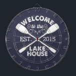 Welcome to the Lake House | Rustic Canoe Paddles Dartboard With Darts<br><div class="desc">Spend your leisurely lakeside hours playing darts with this fun,  unique dartboard. Design features a midnight blue background with "Welcome to the Lake House" in rustic block text and two crossed canoe paddles. Customize with the year established for an awesome housewarming present or gift for your weekend hosts!</div>