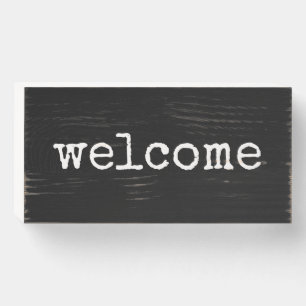 welcome typography whiite text black wooden box sign