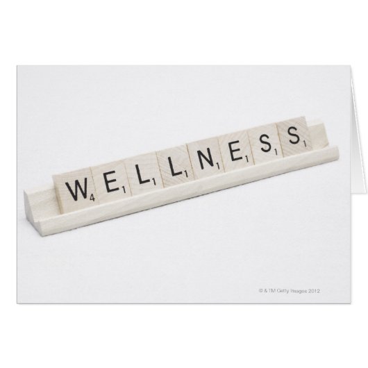 Wellness Spelled On A Word Board Game. (Front Horizontal)