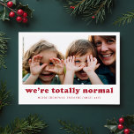 We're Totally Normal Funny Family Photo Christmas Holiday Card<br><div class="desc">Capture the joy and humor of the season with this playful "We're Totally Normal" Christmas card. Featuring a candid family photo, this design embraces the funny, silly moments that make your family unique. The modern red text and simple layout offer a charming yet humorous touch, making this card perfect for...</div>
