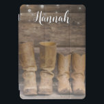 Western Cowboy Boots Rustic Barn Monogram iPad Pro Cover<br><div class="desc">This fun,  rustic iPad cover features two pair of cowboy boots and a log cabin wall with string lights. For the western or horse lover. Created by Simply Farmhouse Press; photo by Melanie Mauer on Unsplash.</div>