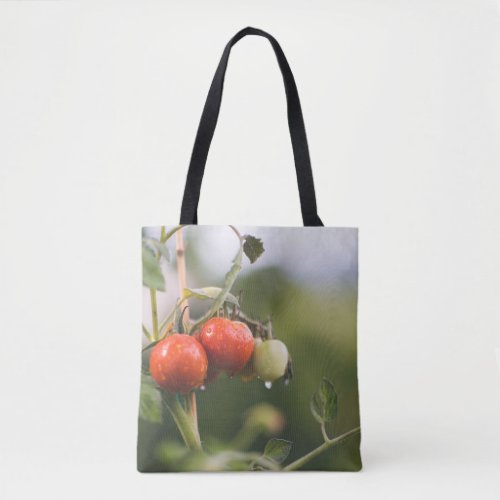 wet tomatoes on the vine tote bag