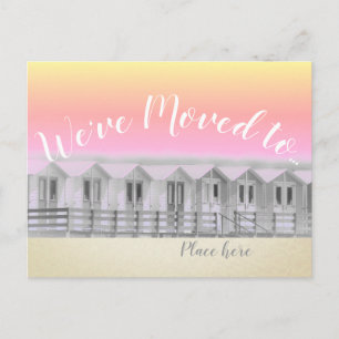 "We've moved" sunset beach hut by seaside postcard