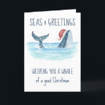 Whale Santa Seas & Greetings Nautical Christmas  Holiday Card<br><div class="desc">Nautical humor Christmas card features a watercolor whale wearing a Santa hat swimming in the sea with string lights decorating its tail. The "Seas & Greetings",   "Wishing you a whale of a good Christmas" and "Happy Holidays" greetings,  along with the name can be personalized. Art by KL Stock</div>