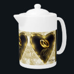 What God Has Put Together Wedding Teapot<br><div class="desc">Beautiful design teapot with a printed image of an acrylic painting with wedding rings inside a heart-shaped ring. Matching latte cups are available.</div>