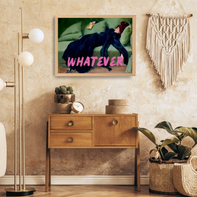 A maximalist vintage-style poster with the word "whatever" written across is seen on a cream wall. To the right of it is a macrame wall hanging, to the left is a lamp, and underneath is a small cupboard with plants situated on top and beside it.