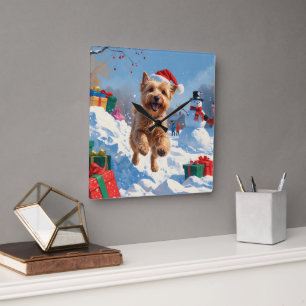 Wheaten Terrier Running in Snow with Christmas Hat Square Wall Clock