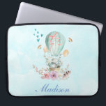 Whimsical Bunny Riding in a Hot Air Balloon Laptop Sleeve<br><div class="desc">Laptop sleeve with a charming illustration of a little bunny riding along in a hot-air balloon decorated with a fancy pink ribbon,  along with some flowers and butterflies. A pastel blue watercolor background gives it a vintage dreamy feel.</div>