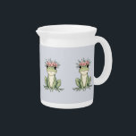 Whimsical Floral Frog Cottagecore Art Beverage Pitcher<br><div class="desc">This charming floral frog illustration captures the essence of cottagecore whimsy with its delicate balance of nature and enchantment. Featuring an adorable green frog crowned with a wreath of soft pink blossoms and leafy accents, this design radiates peaceful woodland charm. The hand-drawn details and gentle pastel tones make it a...</div>