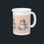 Whimsical Frog in Floral Teacup Beverage Pitcher<br><div class="desc">Whimsical Frog in Floral Teacup Throw Pillow A charming green frog peeks out of a delicate porcelain teacup adorned with soft pink blossoms and gold trim, crowned with a wreath of pastel florals and a tiny royal crown. This endearing scene blends fairytale whimsy with cottagecore elegance, evoking gentle nostalgia and...</div>