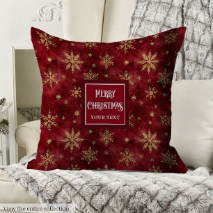 Whimsical gold snowflakes deep red pillow