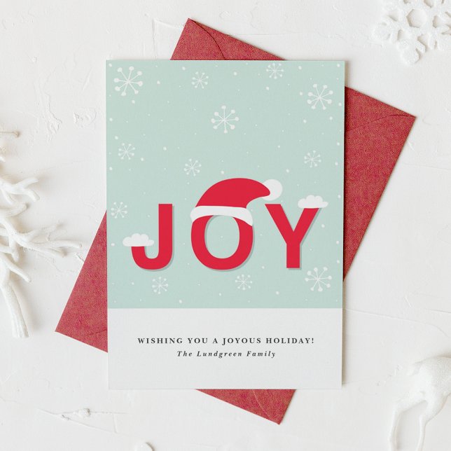 Whimsical Joy Lettering Christmas Greeting Card (This holiday card design showcases the word “JOY” in lettering, playfully topped with a Santa hat.)