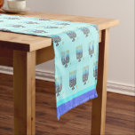 Whimsical Menorahs 14" X 72" Table Runner<br><div class="desc">This charming Whimsical Menorahs 14" X 72" Table Runner features an overall pattern of a whimsical menorah with all the candles lit, on a soft aqua blue background, edged with a gradation of blues like the candles. Perfect for your family Hanukkahs. Also available, matching paper products. Combined with some of...</div>