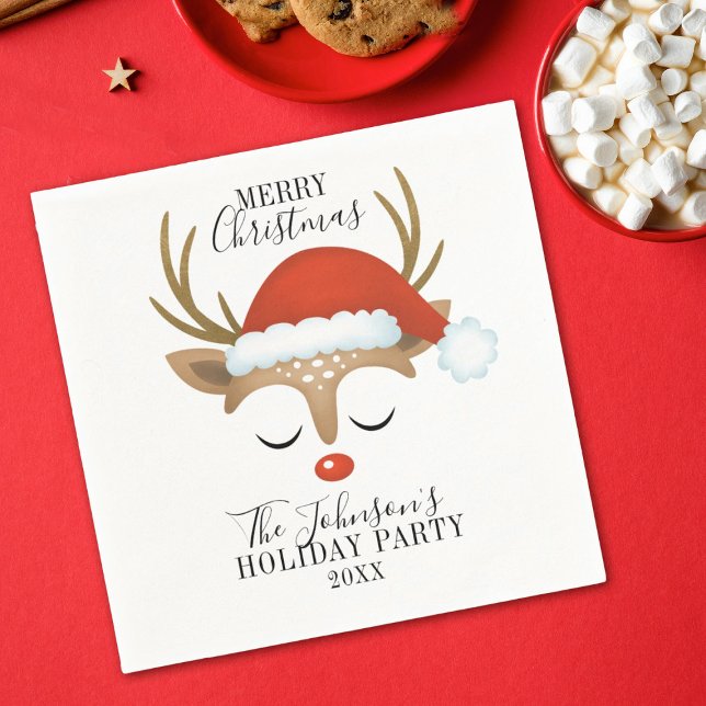 Whimsical Reindeer Christmas Holiday Napkins (A cute reindeer face with a santa hat decorates this paper napkin, So fun for your Christmas party!)
