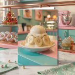 Whimsical Resin Banana Sundae Sister's Birthday   Card<br><div class="desc">Indulge in a birthday treat that’s as "oddly satisfying" as it is sweet! This unique birthday card features a hyper-realistic, glass-like vanilla sundae draped with a translucent glossy glaze and perfectly smooth banana slices. Set against a dreamy retro pastel bakery backdrop, this design captures the satisfying, ASMR-inspired aesthetic of polished...</div>