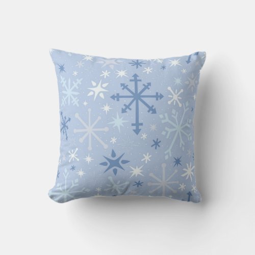 Whimsical snowflake flurry in blues on icy blue throw pillow