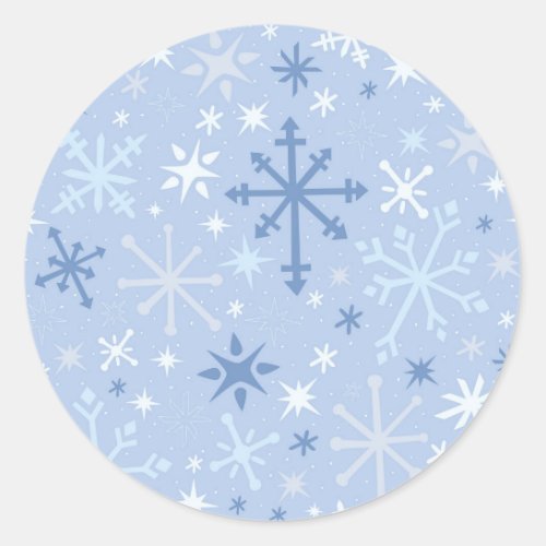 Whimsical snowflake flurry in icy blues classic round sticker