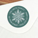Whimsical snowflake pine green return address classic round sticker<br><div class="desc">Winter holiday return address rubber label featuring a white,  whimsical,  folk art style snowflake and your name and address on a pine green background. All colors are customizable.</div>