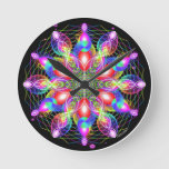 Whirling Rainbow Woman Round Clock at Zazzle