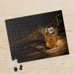 Whiskey on the Rocks  Jigsaw Puzzle<br><div class="desc">Jigsaw puzzle of an ice cube splashing into a crystal whiskey glass on a rustic wood table. Choose from the different sizes available.</div>