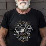 Whiskey Vintage Mens 90th Birthday T-Shirt<br><div class="desc">Celebrate the big 9-0 with style and humor with this vintage whiskey label-inspired birthday design. The black, gold, and white typography is ornate and elegant, giving it a classic retro vintage feel. Perfect for man (or woman!) in your life who loves their scotch, spirits, bourbon, and other liquor drinks. Features...</div>
