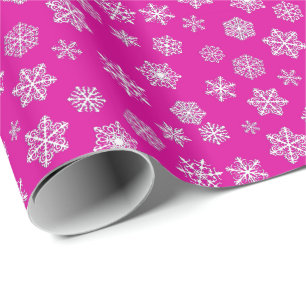 White 3-d snowflakes on a fuchsia pink background wrapping paper