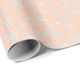 White 3-d snowflakes on a peach background wrapping paper