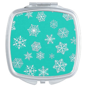 White 3-d snowflakes on a turquoise background vanity mirror