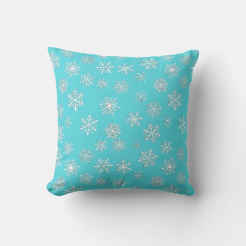 White 3_d snowflakes on an aqua background throw pillow