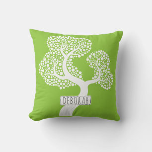 White abstract circle tree and name on lime green outdoor pillow